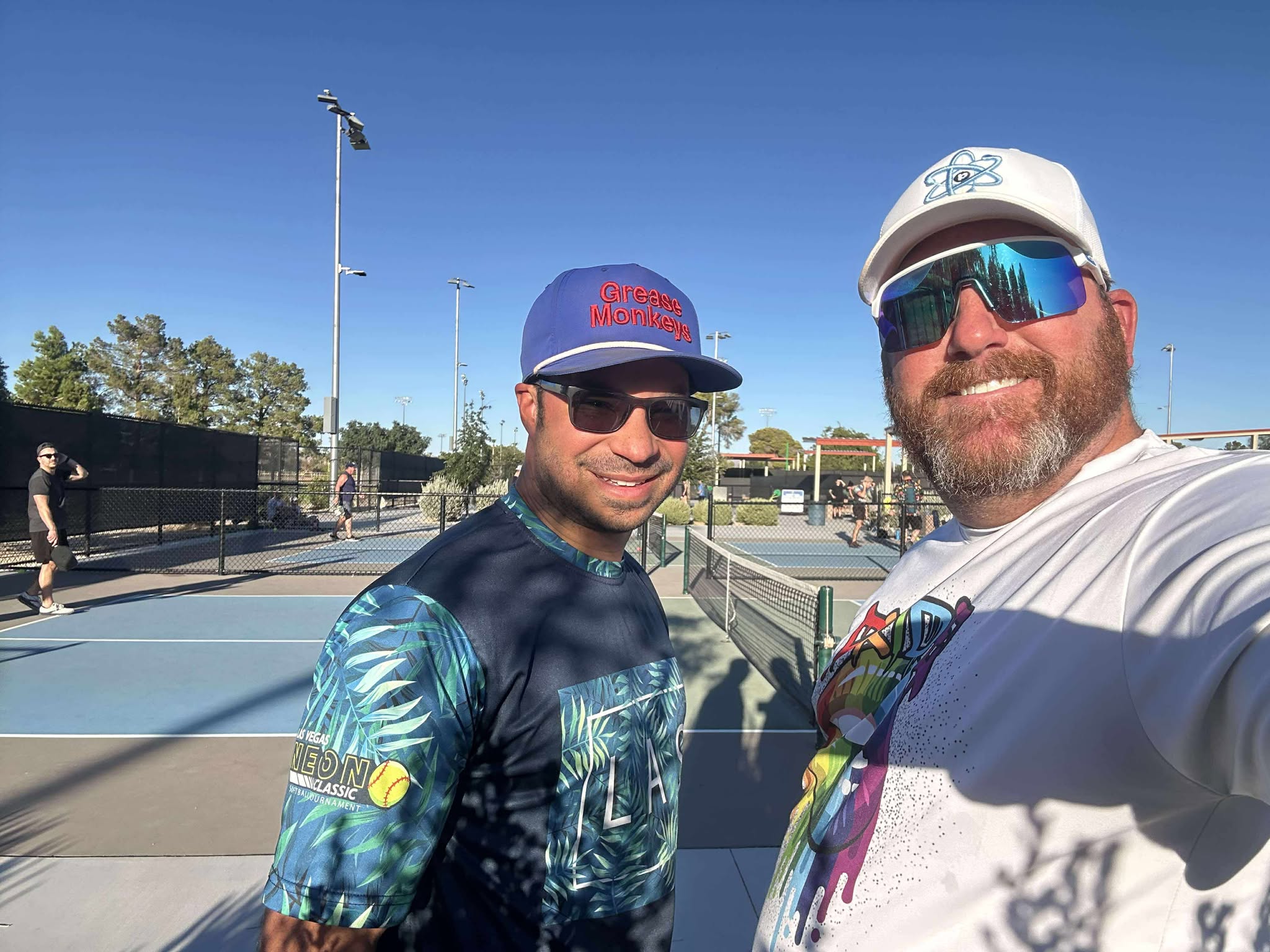 A close-up of a person serving a pickleball